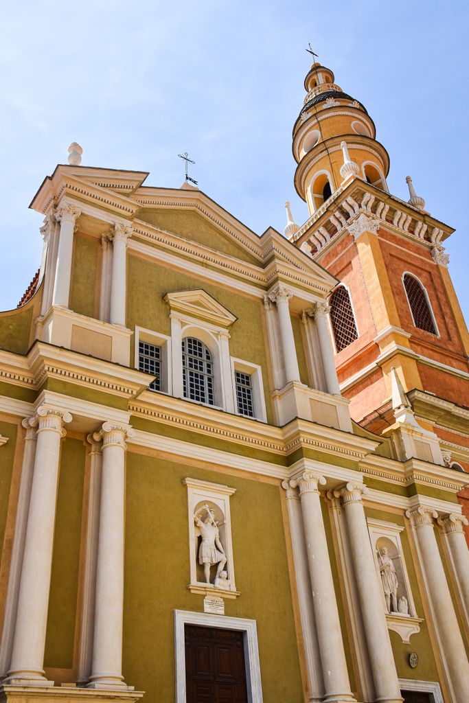 Detailed architectural view of the historic Saint-Michel Basilica in Menton, Provence-Alpes-Côte d'Azur, France.